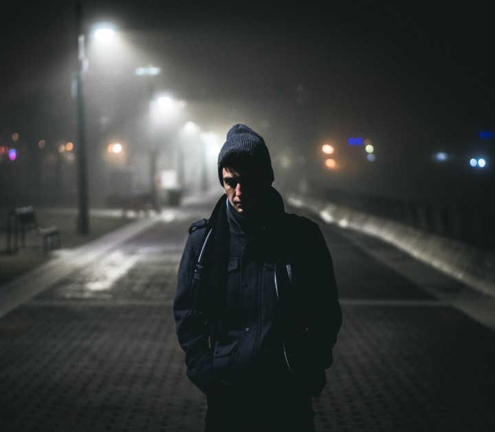man-walking-dark-street